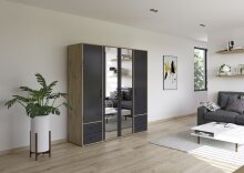 Drehtürenschrank >Voyager< 4 Türen, 4 Schubladen, 5 Böden, 1 Stange, Front grau metallic / Spiegel, Korpus Eiche Artisan Dekor - 187x194x53cm B/H/T